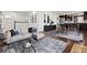Bright and airy living room featuring a comfortable sofa, stylish decor, and hardwood floors at 2033 E 21St Ave, Denver, CO 80205