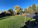 Large backyard with lush lawn and mature trees at 7870 S Ogden Way, Centennial, CO 80122