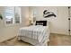 Cozy bedroom with modern decor, window shutters, and a comfortable patterned bed at 14077 Yellow Tip Drive, Parker, CO 80134