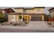 Beautiful two-story home featuring a two-car garage and manicured front yard at 14077 Yellow Tip Drive, Parker, CO 80134