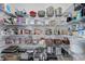 Organized pantry with wire shelving stocked with various food items and kitchen supplies at 14077 Yellow Tip Drive, Parker, CO 80134