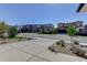 Street view showcasing modern homes, well-maintained landscaping, and curb appeal at 14077 Yellow Tip Drive, Parker, CO 80134
