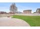 Enjoy this home's spacious backyard, featuring a concrete patio and a fire pit, great for relaxation and entertaining at 5210 Roadrunner Ave, Firestone, CO 80504