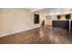 Large finished basement with wood floors, bar area, and plenty of open space at 5210 Roadrunner Ave, Firestone, CO 80504