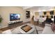 Finished basement featuring a bar, poker table, television, and comfortable seating at 5210 Roadrunner Ave, Firestone, CO 80504