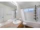 Full bathroom with a shower over bath, large vanity mirror and wood-look flooring at 5210 Roadrunner Ave, Firestone, CO 80504