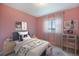 Charming bedroom with bright natural light, a stylish desk, and fun decor at 5210 Roadrunner Ave, Firestone, CO 80504
