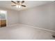 Open bedroom area with carpet and adjacent bathroom at 5210 Roadrunner Ave, Firestone, CO 80504
