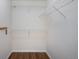Walk-in closet featuring wire shelving, wood-look floors, and neutral walls at 5210 Roadrunner Ave, Firestone, CO 80504