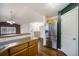 Well-equipped kitchen featuring stainless steel appliances, a breakfast bar, and easy access to the living area at 5210 Roadrunner Ave, Firestone, CO 80504