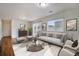 Bright living room with modern furnishings, large window, and stylish decor at 5210 Roadrunner Ave, Firestone, CO 80504