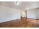 Spacious living room with hardwood floors and neutral walls, ready for your personal touch at 5210 Roadrunner Ave, Firestone, CO 80504