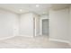 Spacious carpeted basement featuring multiple doorways with access to other areas of the house at 2858 W Parkside Pl, Denver, CO 80221