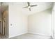 Spacious bedroom with neutral tones, a modern ceiling fan, and carpet flooring at 2858 W Parkside Pl, Denver, CO 80221