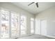 Bright bedroom featuring large windows for plenty of natural light and a ceiling fan at 2858 W Parkside Pl, Denver, CO 80221