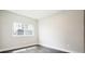 Neutral bedroom with hardwood floors featuring a bright window bringing in natural light at 2858 W Parkside Pl, Denver, CO 80221