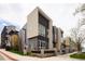 Modern townhomes with distinctive architecture, clean lines, and a well-maintained sidewalk at 2858 W Parkside Pl, Denver, CO 80221