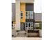 Modern multi-story home featuring a sleek facade, defined entry, and contemporary landscaping at 2858 W Parkside Pl, Denver, CO 80221