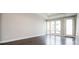 Bright living room featuring hardwood floors and large windows for plenty of natural light at 2858 W Parkside Pl, Denver, CO 80221
