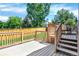 Spacious wooden back deck offers plenty of room for outdoor dining and entertaining with beautiful backyard views at 9682 Hemlock Ct, Highlands Ranch, CO 80130