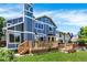 Charming two-story home boasts a well-maintained backyard and wooden deck, perfect for relaxation and entertaining at 9682 Hemlock Ct, Highlands Ranch, CO 80130