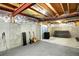 The unfinished basement has musical instruments and concrete walls at 9682 Hemlock Ct, Highlands Ranch, CO 80130