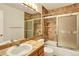 This bathroom has a glass door shower and updated fixtures at 9682 Hemlock Ct, Highlands Ranch, CO 80130