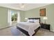 The main bedroom features a ceiling fan and a large window for natural light at 9682 Hemlock Ct, Highlands Ranch, CO 80130