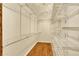 Spacious walk-in closet offers metal shelving and hardwood floors at 9682 Hemlock Ct, Highlands Ranch, CO 80130