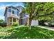 Attractive exterior showcasing a well-maintained lawn and mature trees adding shade at 9682 Hemlock Ct, Highlands Ranch, CO 80130