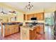 Cozy eat-in kitchen with a breakfast bar, tile countertops, and stainless steel appliances at 9682 Hemlock Ct, Highlands Ranch, CO 80130