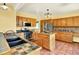 Charming kitchen with wooden cabinets, stainless steel appliances, and a central island at 9682 Hemlock Ct, Highlands Ranch, CO 80130