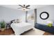 Cozy bedroom with a large window, ample natural light, and contemporary furnishings at 13706 Legend Trail # 104, Broomfield, CO 80023