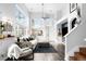 Inviting living room with large windows, stylish furnishings, and high ceilings at 13706 Legend Trail # 104, Broomfield, CO 80023