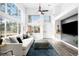 Spacious living room with natural light from large windows and an open, airy layout at 13706 Legend Trail # 104, Broomfield, CO 80023