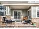 Inviting covered patio with stylish outdoor furniture, perfect for relaxing and entertaining at 13706 Legend Trail # 104, Broomfield, CO 80023