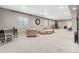 Spacious basement with room for a home office, an elegant sofa, and play area at 18036 E 99Th Ave, Commerce City, CO 80022