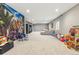 Spacious basement with a T-rex mural, and plenty of room for activities at 18036 E 99Th Ave, Commerce City, CO 80022