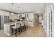 This kitchen boasts an island with bar seating, granite countertops, and sleek stainless steel appliances at 18036 E 99Th Ave, Commerce City, CO 80022