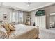 Comfortable bedroom with carpeting, ample natural light, and TV at 18036 E 99Th Ave, Commerce City, CO 80022