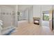 The primary bathroom has a stand up shower, soaking tub, fireplace and a window with wooded views at 31324 Kings Vly, Conifer, CO 80433