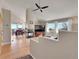 Bright living room with a modern fireplace and large windows providing plenty of natural light and scenic views at 31324 Kings Vly, Conifer, CO 80433