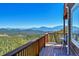 Breathtaking mountain views from this home's deck, a perfect spot to relax and enjoy the scenery at 31324 Kings Vly, Conifer, CO 80433