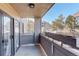 Outdoor balcony with views of the surrounding neighborhood and mature trees at 23634 Pondview Pl # B, Golden, CO 80401