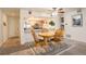 Cozy dining area adjacent to the kitchen with a wooden table set and a ceiling fan at 23634 Pondview Pl # B, Golden, CO 80401