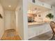 View of the kitchen featuring granite counters, stainless steel appliances, and light wood cabinets at 23634 Pondview Pl # B, Golden, CO 80401