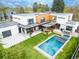 Aerial view of a modern home with a pool, patio, and manicured lawn at 1 S Forest St, Denver, CO 80246