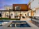 Luxury backyard featuring a pool, jacuzzi, and modern architecture at 1 S Forest St, Denver, CO 80246