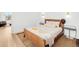 Bright bedroom with warm tones featuring a leather bed frame and natural light from the window at 1 S Forest St, Denver, CO 80246