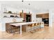Elegant kitchen boasting a large island, modern appliances, and stylish pendant lighting at 1 S Forest St, Denver, CO 80246